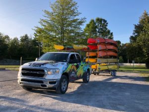 Pick-up truck towing canoes