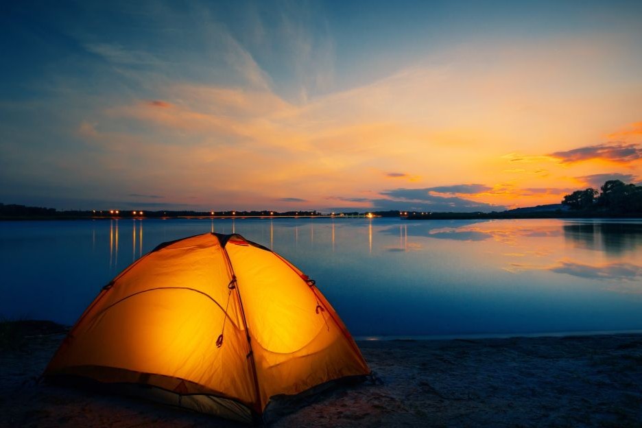 Glowing tent on the beach